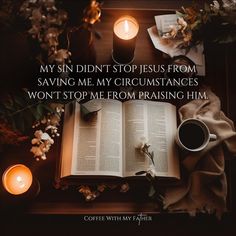 an open book and some candles on a table with the words, my sin didn't stop jesus from saving me my circumstances