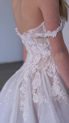 the back of a wedding dress with sequins