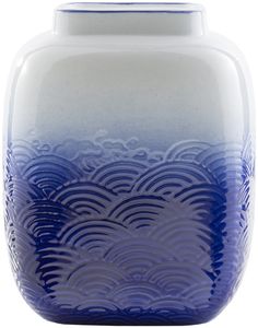 a blue and white vase sitting on top of a table