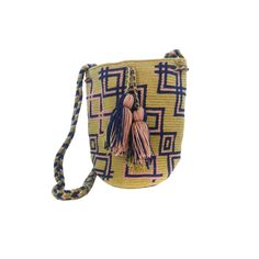 Luxury Mochilas by LUXCHILAS MiniChila Fine - Single Threaded Wayuu Luxury Mochila Bag This beautiful bucket style bag is handwoven for more than 80 hours by women from the Wayuu Tribe. This is the finest quality of the Wayuu mochila. Wear shoulder or cross-body Drawstring with tassels 100% acrylic yarn Size Mini: W x H 23 x 17 cm - 9 x 6.5" Braided strap: Strap drop 54 cm - 21" Handmade in Colombia 🇨🇴 Fair Trade Part of the proceeds is donated to feed the children of the Tribe Multicolor Bucket Bag With Dust Bag, Travel Bucket Bag Handwoven, Yellow Bucket Bag, Woven Bucket Shoulder Bag As Gift, Bucket Straw Bag With Adjustable Strap As Gift, Woven Shoulder Bucket Bag As Gift, Artisan Straw Bucket Bag For Travel, Artisan Bucket Straw Bag For Travel, Woven Shoulder Bucket Bag For Gift