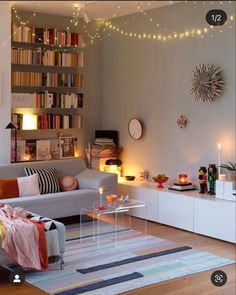 a living room filled with furniture and lots of books