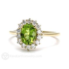 Gorgeously feminine, a pretty Peridot and diamond ring in your choice of 14K or 18K White, Yellow or Rose Gold. At the center is a 1.35ct lovely Peridot, surrounded by a halo of conflict free diamonds, .40cts total weight. So pretty! Peridot is the birthstone for August. Made to order. Please allow three to four weeks for delivery. ABOUT THIS RING Composition: 14K Gold or 18K Gold Shown on Ring Size 6.5 Finger Center Stone: Natural Peridot Color: Yellowish Green Approx. Weight: 1.35ct Shape/Cut: Cluster Ring For Wedding With May Birthstone, May Birthstone Cluster Ring With Gemstones, Gemstone Cluster Ring For May Birthstone, Fine Jewelry Peridot Diamond Wedding Ring, Fine Jewelry Peridot Diamond Ring For Wedding, Classic Wedding Diamond Ring With Peridot, Peridot Engagement Rings Vintage, Peridot Engagement Rings, August Month