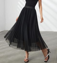 Look your best in the Prestigious Tulle Pleated Flowy Maxi Skirt. This lightweight and comfortable skirt is crafted from soft tulle that is pleated for maximum comfort. Its flowy skirt design adds a touch of class and elegance to your wardrobe. Perfect for formal occasions or everyday wear. 100% Polyester Imported Elegant pleated design: This pleated skirt features a beautiful pleated design that creates a flowing, elegant silhouette. The pleats are evenly spaced and give the skirt a luxurious t Flowy Maxi Skirt, Comfortable Skirts, Flowy Maxi Skirts, Winter Knit Hats, Soft Tulle, Black Sparkle, Touch Of Class, Flowy Skirt, Look Your Best