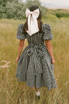 The perfect fall dress for family matching has arrived! Introducing our Cupcake Dress in Black Gingham! Featuring a timeless print, short puff sleeves, functional bow, square neckline, 100% cotton fabric and knee-length fit. This dress is lovely for any and every occasion, from apple picking with the kids to wedding celebrations and more.