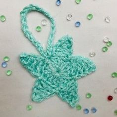 a crocheted star ornament on a table