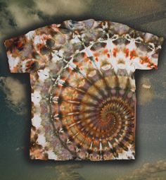 a tie dyed t - shirt with an image of a spiral design