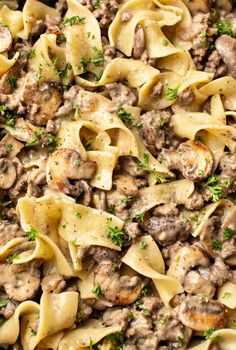 pasta with sausage and mushrooms in a skillet