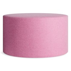 a pink round ottoman sitting on top of a white floor