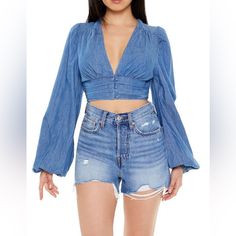 New With Tags. A Denim Crop Top Featuring A Plunging Neckline, Long Bell Sleeves, And A Pintucked Hem With Tonal Buttons. Size Small. Zero Stretch. Not Big Bust Friendly. I’m A 34 C & The Top Wouldn’t Button For Me . Content + Care - 100% Cotton - Machine Wash Cold Size + Fit - Model Is 5'6" And Wearing A Small Denim Crop Top, Big Bust, Jeans Tops, Jean Top, Plunging Neckline, Bell Sleeve, Bell Sleeves, Dress Shop, Fitness Models