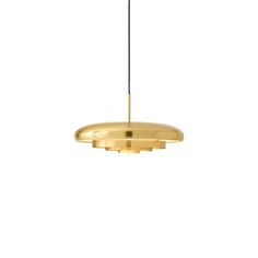 a gold pendant light hanging from a ceiling