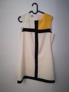 "AIDA DRESS Handmade dress 100% Polyester Colors: white, yellow, black Mondrian dress This dress is made under request, so there is no stock. Since is only made under request, can not be returned ( read my policies concerning conditions for exchanges or returns) CAN I CHANGE THE COLOR? YES Just add to your cart the listing special request, aswell for lining or other changes as alterations https://www.etsy.com/uk/listing/624364219/special-requests?ref=shop_home_active_1&frs=1 ARE YOU ON A RUS Modern White A-line Mini Dress, White Retro Sleeveless Dress, White Retro Mini Dress For Summer, Retro White Mini Dress For Summer, White A-line Mini Dress In Mod Style, White A-line Mod Dress, White Sleeveless Mod Dress, White Mod Mini Length Dress, White Sleeveless Mod Mini Dress