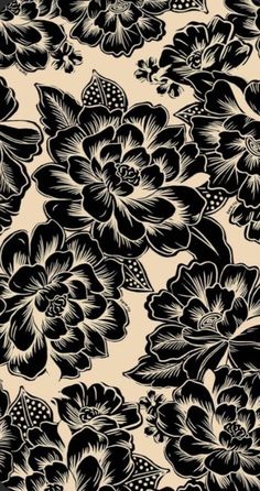 a black and white flower pattern on a tan background with red flowers in the center