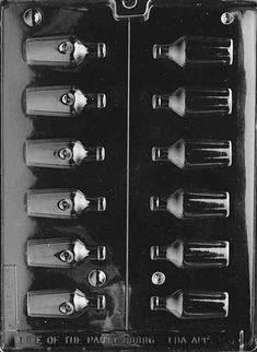 an old black and white photo of many toothbrushes in a plastic case on a table