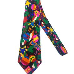 Addiction 90s multi-Color black, blue, red-orange green Holiday 100 SILK Tie Dark with a Splash of Bright colors this is perfect for the Alt bashes coming up this holiday season  Vintage Addiction Multi Holiday Theme  100 Silk Novelty Necktie  Tag States Hand Made  A perfect funky mix of different bright colors and wild patterns with themed objects Great Condition No flaws  For a limited time, we send out a surprise discount when you click the heart on your favorite items! Watch your updates (or the bell on the top right hand) for it to show.  :)   -We are unable to offer cancellations or returns.   If there is an issue with your purchase, we would be happy to offer store credit instead.  Once your return has been received in the condition it was sent, we will send you a promo code for you Holiday Theme, Cool Ties, Holiday Themes, Tie Accessories, Packing Material, Heart On, Suit And Tie, Silk Ties, Neck Tie