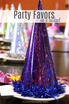 party favors on a budget with purple and blue confetti cones, streamers and paper plates