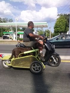 a man riding on the back of a small motorcycle