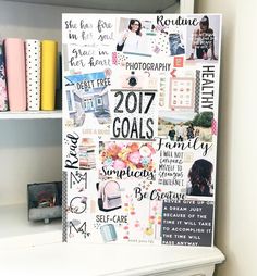 a white board with lots of pictures and words on it next to some bookshelves