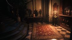 a dimly lit room with an ornate rug on the floor and stairs leading up to it