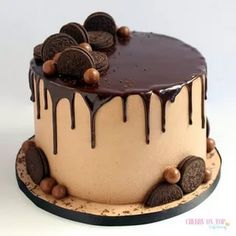 an oreo cookie cake with chocolate icing and drizzled on top