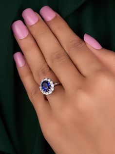 a woman's hand with a ring on it