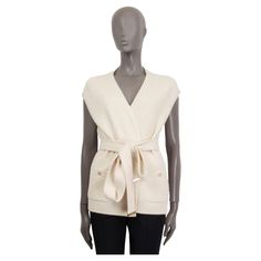 100% authentic Chanel Pre-Fall 2018 belted sleeveless knit cardigan in off-white cashmere (100%). Features two shut sewn 'CC' buttoned slit pockets on the front. Unlined. Has been worn and is in excellent condition. Matching pants available in separate listing. Measurements Tag Size 40 Size M Bust 104cm (40.6in) to 130cm (50.7in) Waist 108cm (42.1in) to 140cm (54.6in) Hips 110cm (42.9in) to 144cm (56.2in) Length 65cm (25.4in) All our listings include only the listed item unless otherwise specifi Chanel Cardigan, Sleeveless Cardigan, Sleeveless Knit, Matching Pants, Fall 2018, Terms And Conditions, Knit Sweater Cardigan, Pre Fall, Cardigan Sweater