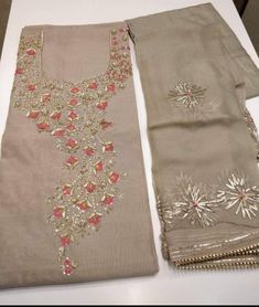 Item Overview ATHARVA Hand Embroidered Salwar Kameez  in Mud Brown Chanderi w/Elegant Neck embroidery w/Gota Pati  Chiffon Dupatta and Santoon Salwar Dno. CH1417 Fabric:  * Shirt Chanderi Silk - 2.5 Mts - Mud Brown  * Dupatta: Pure Chiffon Chinnon Dupatta: 2.5Mts w/Beautiful Gota Patti  Design  * Bottom: Santoon Silk - 2.5 Mts.  Excusive Hand Embroidered Party Wear Punjabi Suit. Customization: * Fabrics: Designs Can be made in different Fabrics. * Stitching Available Care: * Dry Clean/ Avoid dir Designer Semi-stitched Beige Churidar, Semi-stitched Georgette Salwar Kameez With Dori Work, Beige Chanderi Sets For Navratri, Beige Georgette Sharara With Zari Work, Designer Beige Churidar For Diwali, Festive Beige Designer Churidar, Semi-stitched Beige Embroidered Unstitched Suit, Designer Beige Kurta With Mirror Work, Beige Anarkali Set With Zari Work In Georgette