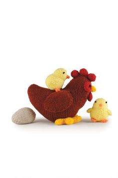 a knitted chicken and two chickens next to an egg