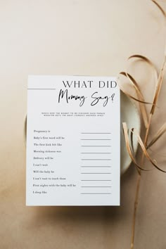 what did mommy say? written on a card next to a bowl with dried grass