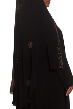 Create amazing looks with our Saba Ghashwa. This gorgeous design will enhance your abaya by giving you a striking silhouette with a hint of sparkle. Elevate your style darling and wear this beautiful ghashwa. Need some style tips? Check out our video on how to wear a ghashwa Made with luxuriously soft chiffon Long ghashwa 45" inches Delicately adorned with gold crystals Abaya not included Made in Dubai Embellished Abaya For Eid, Elegant Maxi Length Niqab For Eid, Elegant Dabka Khimar, Gold Crystals, Garment Workers, Style Tips, Gorgeous Design, In Dubai, Dubai