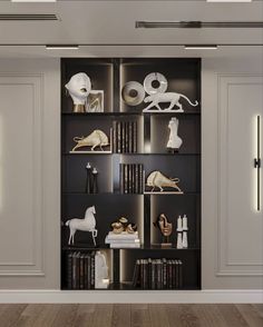 a book shelf filled with books and figurines on top of it's shelves