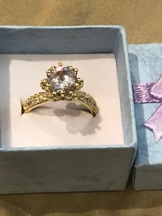 *GIFT BOX INCLUDED!*This beautiful 18K gold round cubic zirconia ring is adjustable with an 18K gold plating covering a high quality copper. This adjustable 18K Gold Round Cubic Zirconia Ring is 6mm in width and 4mm in thickness. We ship this ring the same business day to ensure a fast delivery. Please message me if you have any questions in regards to this ring or your order.Thank you for choosing Humble Legends! :) Elegant Gold Round Crystal Ring, Elegant Gold Crystal Ring, Gold Cubic Zirconia Jewelry For Proposal, Yellow Gold Cubic Zirconia Crystal Ring Gift, Gold Cubic Zirconia Rings For Proposal, Cubic Zirconia Crystal Ring Gift, Cubic Zirconia Crystal Ring Gift Round Cut, Gold Round Crystal Promise Ring, Gold Cubic Zirconia Crystal Ring As Gift