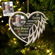 a memorial ornament hanging from a christmas tree