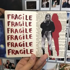 a person holding up a book with the words fragile, fragile and fragile on it