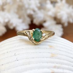 Estate/ vintage 14KT yellow gold ring with oval, genuine emerald + diamond accents. Stunning deep, green color on this emerald. Emerald is the birthstone for May babies + this ring makes a fantastic gift! Size 6.5 Weight: 2.10g Genuine, oval-cut, emerald measures: 6.5mm x 5mm .65~ .70 CT natirual diamonds (6) round diamonds; SI/I clarity; I color Stamped 585 (14K) Excelent estate condition Emerald Oval Cabochon Ring As A Gift, Fine Jewelry Emerald Oval Cabochon Ring For May Birthstone, Heirloom Oval Cabochon Emerald Ring, Heirloom Oval Emerald Ring, Heirloom Oval Green Emerald Ring, Luxury Emerald Ring With Oval Cabochon Center Stone, Emerald Ring With Oval Cabochon Center Stone, Emerald Oval Cabochon Ring With Center Stone, Oval Cabochon Emerald Ring With Center Stone