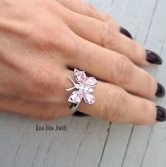 Pink CZ butterfly silver ring, clear - butterfly ring, silver ring, promise ring - 925 sterling silver Height: 16.0mm Width: 17.0mm Shank Width: 1.7mm Stone Material: Pink and White Cubic Zirconia Center Stone Size: 7.0mm x 5.0mm & 6.0mm x 4.0mm Stone Shape: Pear and Round Center Stone Carat Weight: 0.71 ct. & 0.39 ct. Number of CZ Stones: 8 Stone Setting: Prong Metal: 925 Sterling Silver Plating: Rhodium Finish: High Polish simply stunning. High Polished, solid 925 sterling silver. Rhodium plat Elegant Cubic Zirconia Butterfly Ring, Adjustable Elegant Rings With Butterfly Charm, Elegant Butterfly Ring Gift, Silver Cubic Zirconia Flower Ring Gift, White Cubic Zirconia Butterfly Ring, Formal Butterfly-shaped Cubic Zirconia Rings, Fine Jewelry Butterfly Shape For Wedding, Diamond Butterfly Ring For Wedding, Elegant Butterfly Diamond Ring For Gift