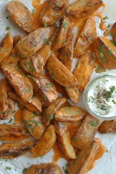 chicken wings with ranch dressing on top