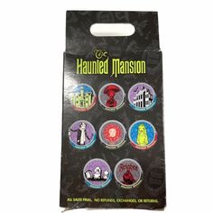 a package of halloween buttons with the words,'happy halloween mansion'on them