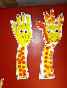 two giraffes made out of construction paper