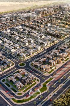 an aerial view of a city with lots of buildings and streets in the foreground