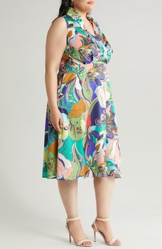 A vibrant retro print enlivens this rich satin midi designed in a sleeveless silhouette with a surplice V-neck and a shaping back tie. 47" length (size 1X) Spread collar Surplice V-neck Sleeveless Side-seam pockets Attached back sash Lined 100% polyester Dry clean Imported Sleeveless Multicolor Silk Midi Dress, Multicolor Sleeveless Silk Midi Dress, Multicolor Silk Sleeveless Midi Dress, Chic Sleeveless Midi Dress With Vibrant Print, Sleeveless Midi Dress With Vibrant Print, Retro Sleeveless Multicolor Print Dress, Retro Multicolor Print Sleeveless Dress, Hairstyling Products, Fragrance Cologne