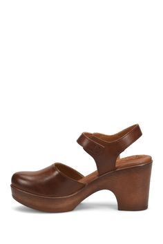 A woodgrain platform heel on a clog-inspired pump brings retro style to your ensembles. 3" heel Round toe Adjustable slingback strap with buckle closure Cushioned footbed Synthetic upper and lining, rubber sole Imported Brown Platform Slingback Pumps With Open Heel, Brown Slingback Pumps With Ankle Strap And Platform, Brown Platform Slingback Pumps With Ankle Strap, Brown Slingback Pumps With Buckle Closure And Round Toe, Brown Ankle Strap Platform Clogs, Platform Heel, Platform Pumps, Platform Heels, Women's Pumps