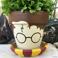 a potted plant with glasses painted on it's face and the words harry potter