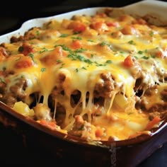 a casserole dish filled with meat and cheese