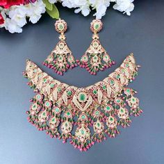 The traditional and intricate bridal jaday necklace set in 22ct gold. The necklace weighs 71.77 GMs including 10.12 GMs of hanging beads. The earrings weigh 24.25 GMs including 4.30 GMs of hanging beads. Price Breakup Summary Component Rupees % of Total 22k Gold 394,838 75.6% Stones & Beads 41,236 7.9% Making Charges 71,071 13.6% Taxes (GST) 15,214 3.0% Total 522,359 100.0% View Detailed Price Breakup Watch Video Here Green 22k Gold Bridal Necklace For Wedding, Green 22k Gold Jewelry Set For Wedding, Green 22k Gold Wedding Jewelry Set, Kundan Bridal Necklace In Yellow Gold, Yellow Gold Kundan Bridal Necklace With Hand Set, Hand Set Kundan Bridal Necklace In Yellow Gold, Traditional Gold Chandbali Emerald Necklace, 22k Gold Bridal Chandbali Necklace With Stone Work, Gold Plated Chandbali Temple Necklace