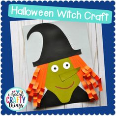 a paper witch with orange hair and black hat on it's head is shown