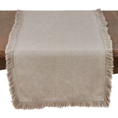 a table runner with fringes on it