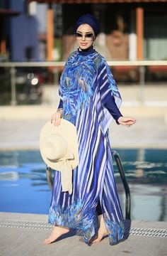 Ready to meet a modest elegance with a feminine look of purple, blue, floral patterns, and soft fabric? Our Burkini pareo caftan is designed to create a great combination with other burkini sets with its vivid and trendy look. Thanks to its soft and light texture, it will make you look perfect and reinforces your elegance when you are around the pool. Hey, especially Lycra Fabric Blue is a great option to combine with Phoenix Burkini! Blue Long Sleeve Swimwear For Beach Cover-up, Blue Long Sleeve Dress For Poolside, Blue Long Sleeve Poolside Dress, Multicolor Summer Abaya For The Beach, Summer Multicolor Abaya For Beach, Multicolor Summer Beach Abaya, Blue Beachwear Kaftan For Pool, Floral Print Kaftan For Beach And Eid, Floral Print Kaftan For Eid At The Beach