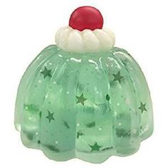 a green glass christmas pudding ornament with stars and a santa hat on top