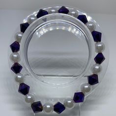 Material: White String Color: Purple and White Beads Type: Bracelet Style: Fashionable Elegant Hypoallergenic Purple Beaded Bracelets, Purple Bracelet With Polished Beads, Purple And White Bracelet, Purple 8mm Beads Bracelet, Affordable Hand-strung Purple Beaded Bracelets, The Purple, White Bracelets, Handcrafted Bracelets, Beaded Bracelet