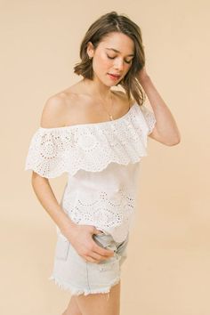 This White Eyelet Off Shoulder Top is the ultimate summer blouse that goes with just about anything! Pair this white eyelet blouse with Bella Chic Fashion jeans, shorts, or skirts. Product Description: A woven eyelet top featuring off the shoulder neckline with flounce, and relaxed body Details Self :100% Exclusive of decoration Size & Fit - Model is 5'8" And Wearing Size Small - Measurements Taken From Size Small - Approx. Length: 16.5" Spring Summer Off-shoulder Top, White Off-shoulder Top With Ruffles For Day Out, White Ruffled Off-shoulder Top For Day Out, Fitted Feminine Off-shoulder Top For Summer, Feminine Off-shoulder Top For Summer, Feminine Off-shoulder Summer Blouse, Summer Off-shoulder Feminine Blouse, White Fitted Off-shoulder Top For Summer, Fitted White Off-shoulder Top For Summer